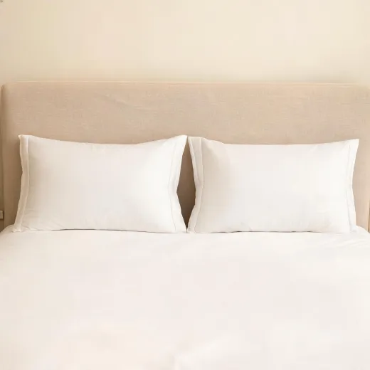 Set of sleeping pillows in a tidy bedroom